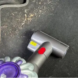 Mumsnet editor Rachel Erdos testing the Dyson Car+Boat Handheld Vacuum Cleaner