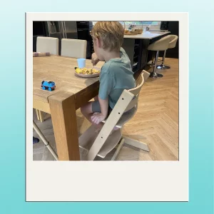 stokke tripp trapp highchair tester image showing child using chair from behind