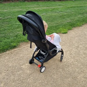 Child in Stokke Yoyo 5 on gravel path