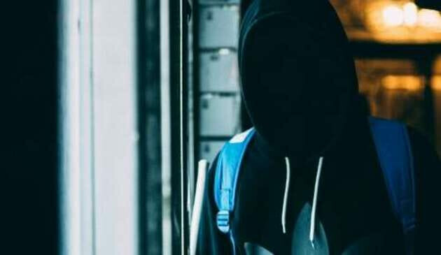 Figure with face in shadow