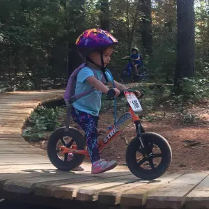 Child riding Strider 12 Sport balance bike