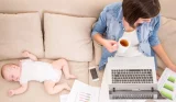 Woman studying with baby