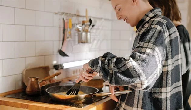 Teenagers cooking in the kitchen