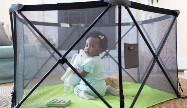 Child in Summer Infant Pop N Play playpen