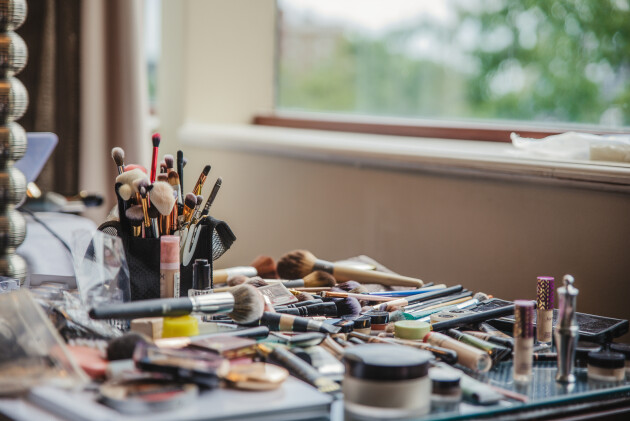 a desk covered in makeup