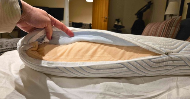 A hand shows the cover unzipped on the Tempur Cloud Smartcool pillow