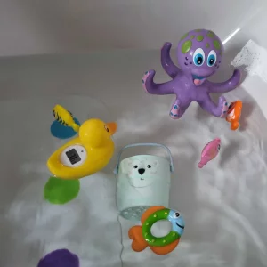 TensCare Digi Duckling in bath with other baby bath toys