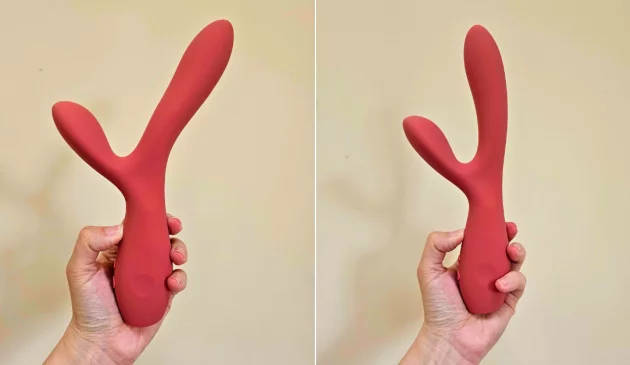 A side by side view of a hand holding the Smile Makers' The Artist dual motor rabbit vibrator