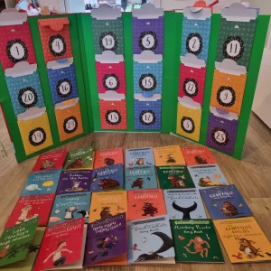 The Gruffalo and Friends Advent Calendar Book Collection open with 24 mini books laid out