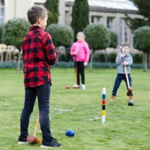 Kids playing croquet in the grounds of the Ickworth Hotel in Suffolk