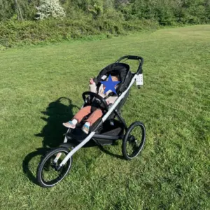 Child sat in Thule Glide 3 running buggy