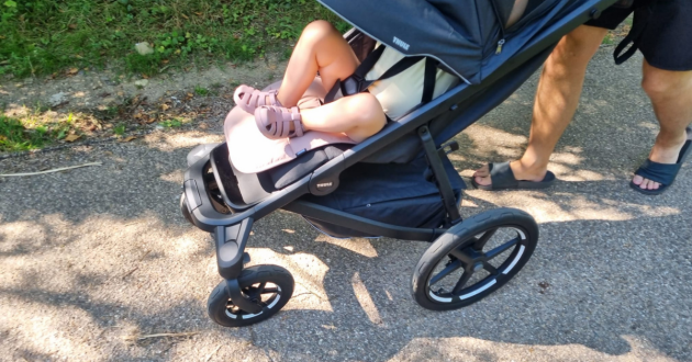 Toddler in Thule Urban Glide 4-Wheel buggy