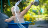Baby playing with water