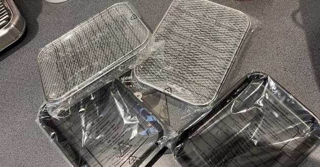 Removable mesh baskets and drip trays included with the Tower Vortx Vizion air fryer oven