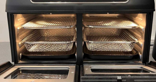 Interior view of the Tower Vortx Vizion air fryer oven with both compartments open and internal lights on