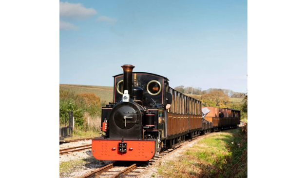 a black and red steam train