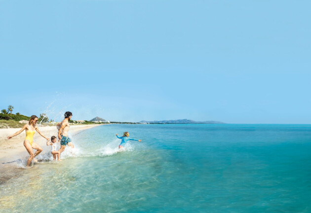 Family paddling in the sea on a TUI holiday