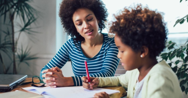Mother and child learning at home together