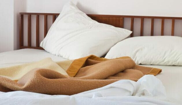 Unmade bed in Summer