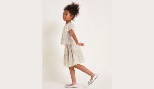 Young girl models the Adele sequin skirt natural from Monsoon