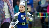 A little boy dressed as a knight at an English Heritage destination