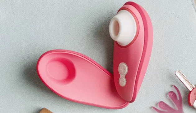 A birds-eye view of the Womanizer Liberty 2 open on a table