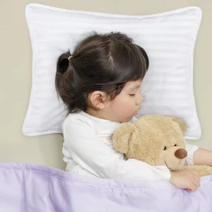 Utopia Bedding Toddler Pillows 2-Pack in use with a child sleeping