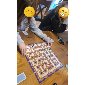 Labyrinth board game being played by real children