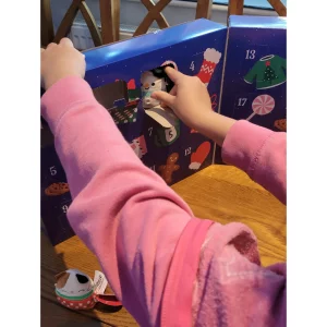 Squishmallow micromallow advent calendar in testing - showing child getting a snowman micromallow