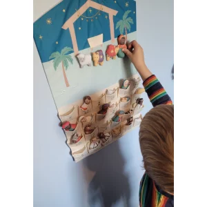 JoJo Maman Bebe Hanging Advent Calendar in testing showing child placing the nativity figures