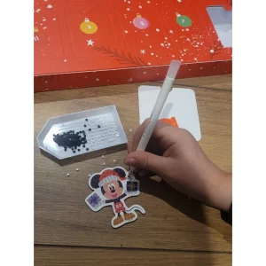 Disney Crystal Art advent calendar in testing showing child sticking on the crystals