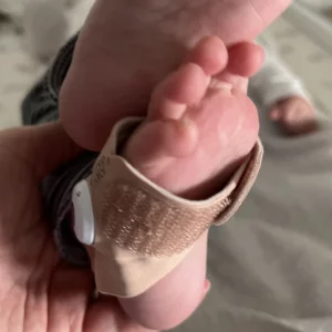 Owlet Dream Duo Smart Baby Monitor in testing: baby's foot in smart sock