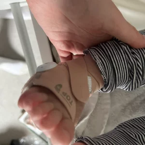 Owlet Dream Duo Smart Baby Monitor in testing: baby's foot wearing smart sock