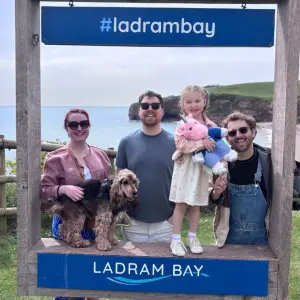 Ladram Bay Holiday Park, Devon review image of family by sign