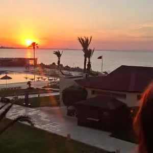 Holiday Village AQI Skanes Tunisia relax pool and coastline at sunset