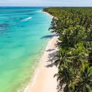 Tropical island shot of white sandy beach, turquoise sea in Dominican Republic