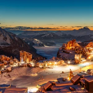 Avoriaz, France wide aerial shot of resort and mountains at night