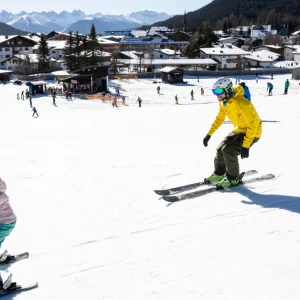 Family skiing in Seefeld ski resort, Austria
