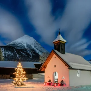 Seefeld ski resort Christmas tree and small church at night