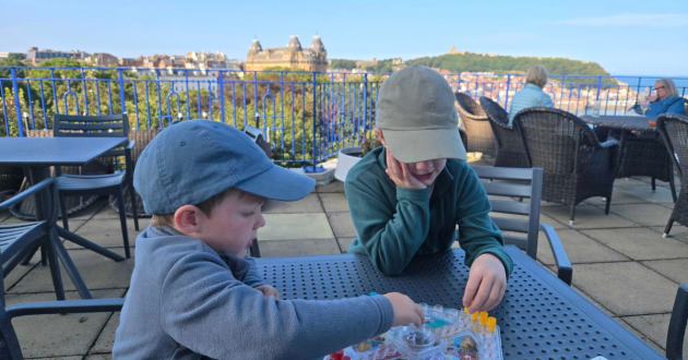 Children play games on a terrace at the Esplanade Hotel Scarborough