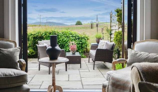 A picture taken from inside Woodend Cottage looking out at the view.