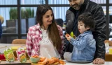 A mother and father with their toddler at Iceland testing Little Explorers ready meals