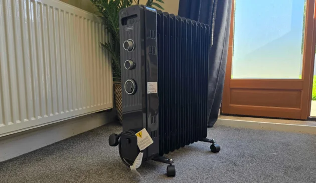 The Vonhaus 11 Fin Oil Filled Radiator with Timer 2500W in a living room