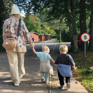 A family walking in the grounds at Whitemead Forest Park in the Forest of Dean
