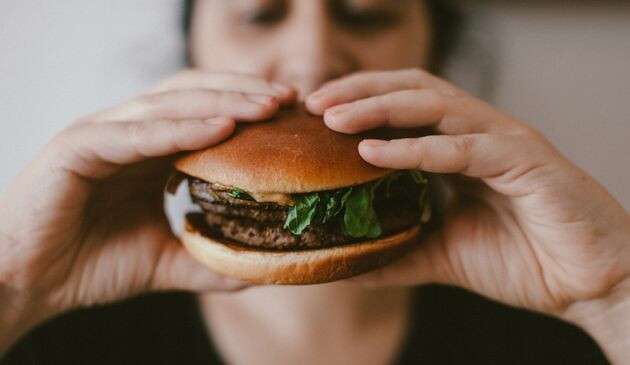 Woman holding a burger