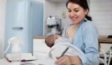 Woman holding baby after pumping milk