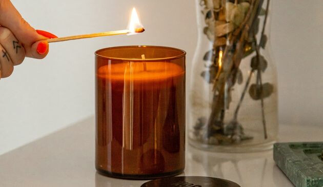 Woman lighting candle
