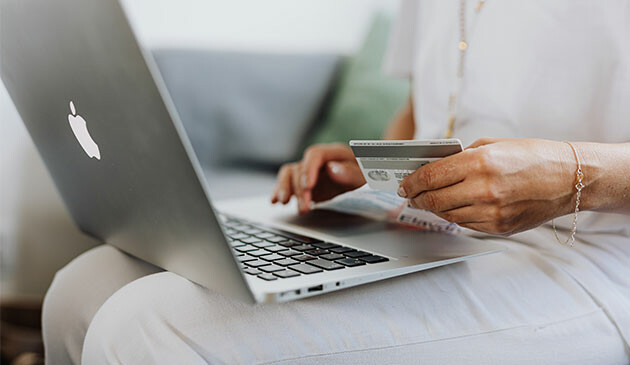 Woman shopping online on laptop
