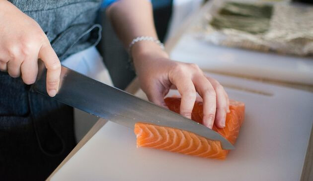 Woman preparing salmon