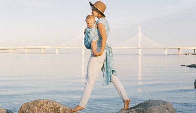 Woman wearing baby sling